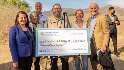 Group photo with big check