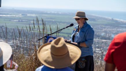 Melissa Baffa, Executive Director of the Ventura Land Trust at podium, speaking