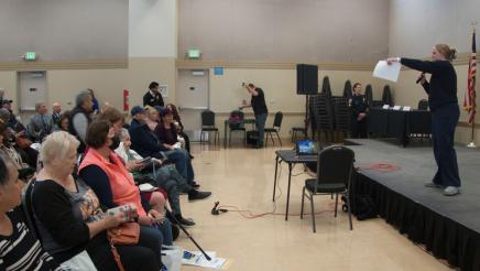 Guest speaker on stage speaking to audience