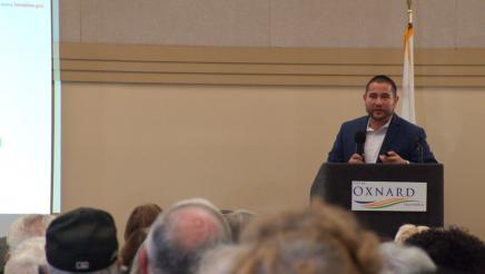 Guest speaker at podium, speaking to audience