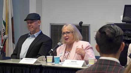 Linda Braunschweiger (center) of Housing Trust Fund of Ventura County speaking