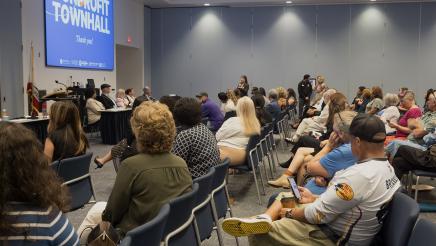 Attendees listening to another question from a fellow audience member