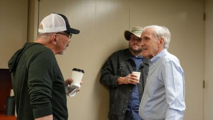 Assemblymember Bennett conversing with an attendee