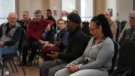 An attendee asks Asm. Bennett a question