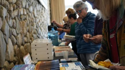 Attendees gathering resources and informational materials.