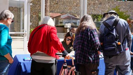 Attendees line up to register.