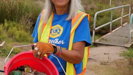 Constituent poses with trash 