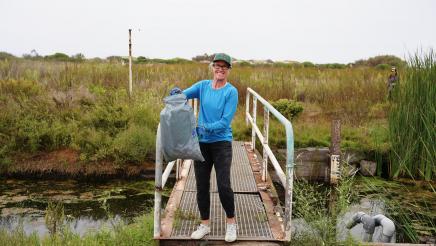 Constituent poses with trash 